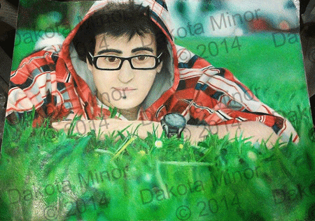 prisma color pencil drawing of a boy with glasses in a red plad jacket laying in the grass