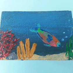 wooden box with ocean fish painted on it